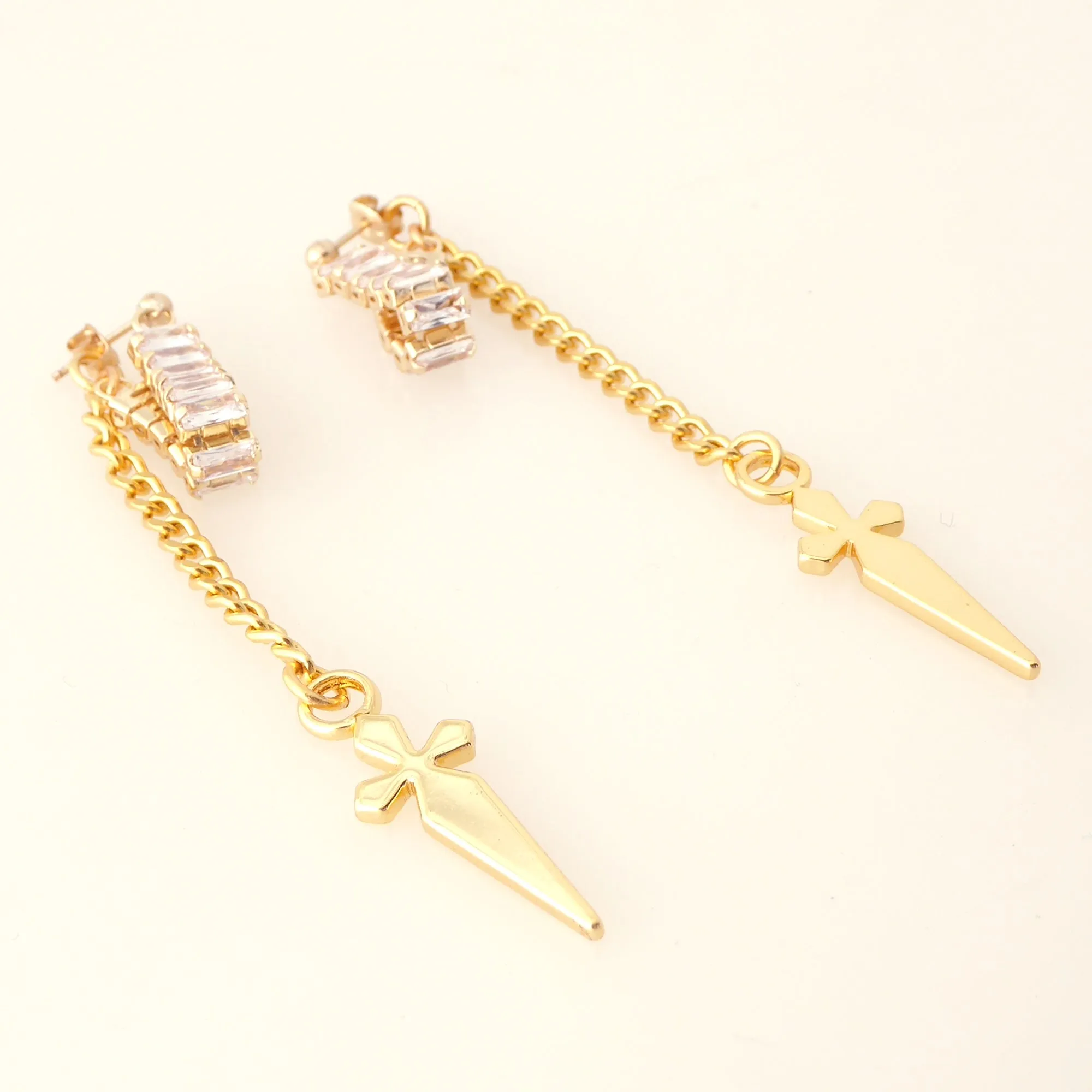 Gold rhinestone baguette dagger earrings