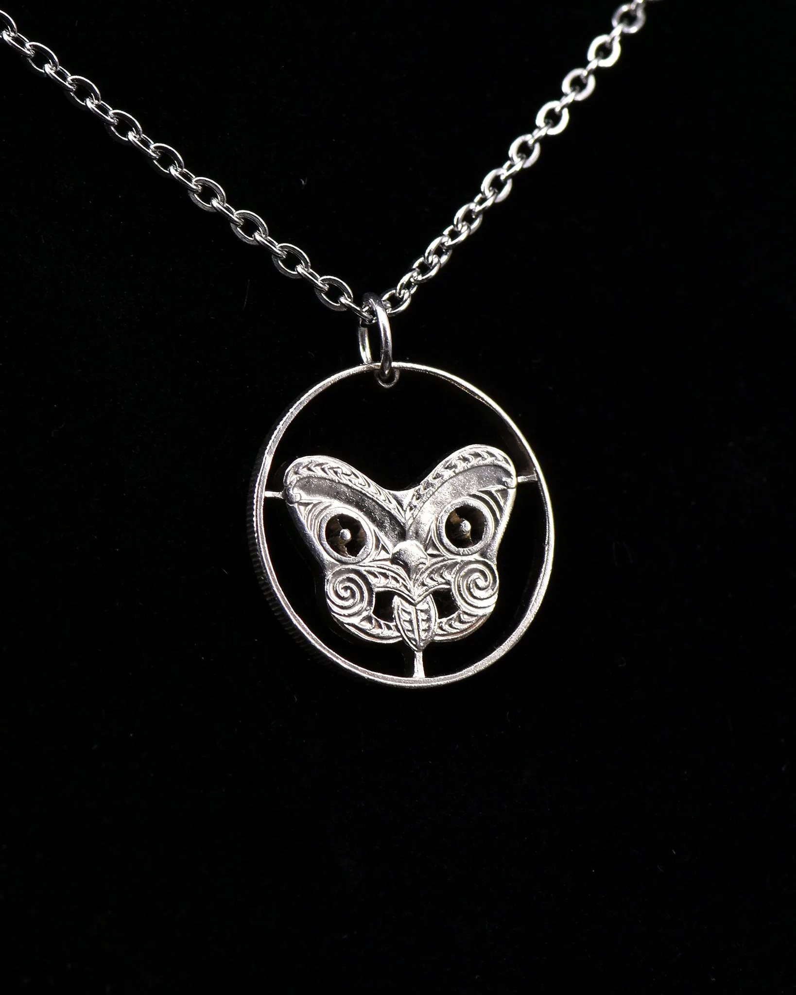 New Zealand - Maori Koruru Mask Cut Coin Pendant