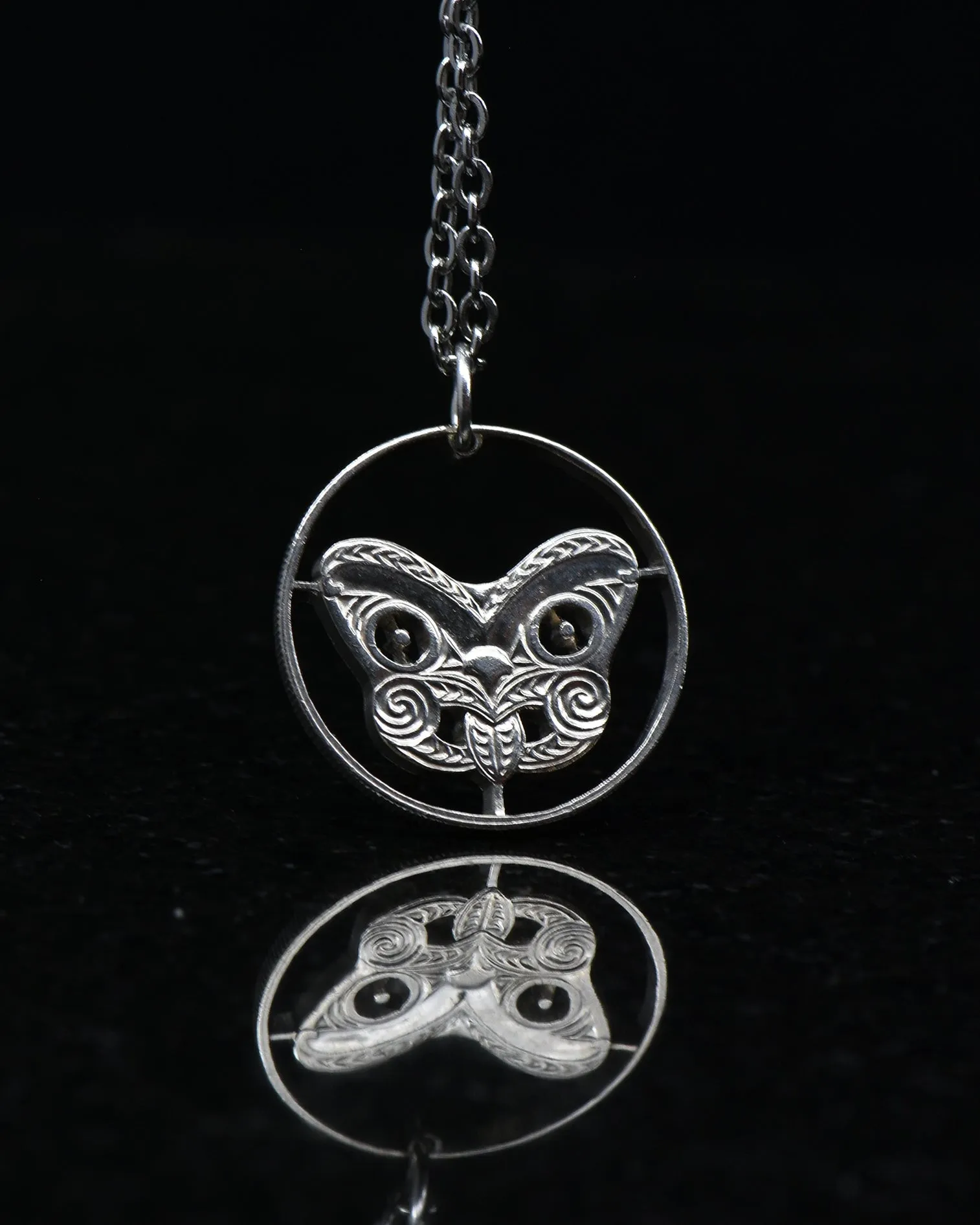 New Zealand - Maori Koruru Mask Cut Coin Pendant